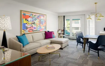 a living room with a couch and a table at Le Parc at Melrose in Los Angeles