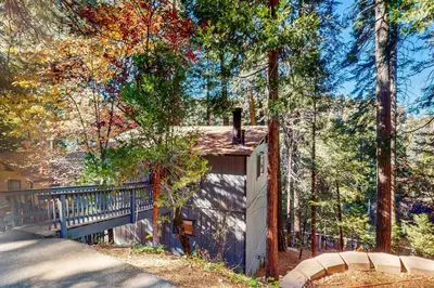 a house in the woods with a porch at The Treehouse in Lake Arrowhead