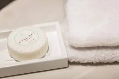 a container of mayonnaise next to a pile of towels at Mosaic Hotel Beverly Hills in Los Angeles