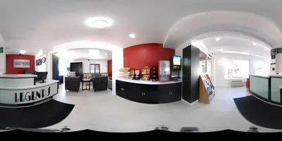 a kitchen and living room with red and white walls at Legend Hotel Hollywood in Los Angeles