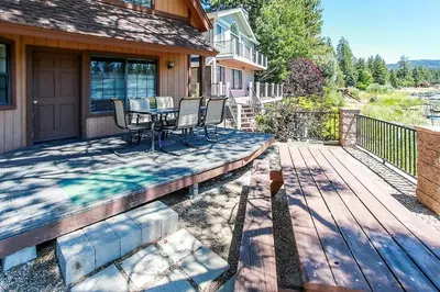 a patio with a table and chairs on a house at Breezy One-112 by Big Bear Vacations in Big Bear Lake