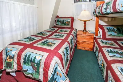 a bedroom with two twin beds and a lamp at Breezy Two-113 by Big Bear Vacations in Big Bear Lake