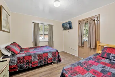 a hotel room with two beds and a window at Shore Acres Lodge-451 by Big Bear Vacations in Big Bear Lake