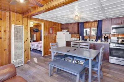 a kitchen with a table and chairs in a room at Shore Acres Lodge-451 by Big Bear Vacations in Big Bear Lake