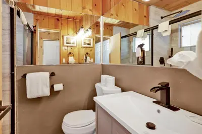 a bathroom with a toilet and a sink at Shore Acres Lodge-450 by Big Bear Vacations in Big Bear Lake