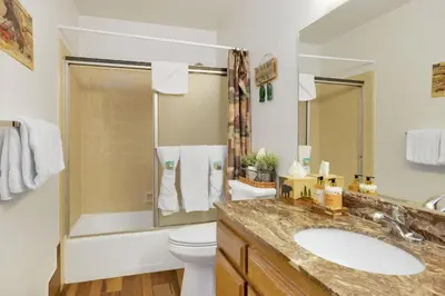 a bathroom with a sink and a toilet and a shower at Ski Time Getaway-1848 by Big Bear Vacations in Big Bear Lake