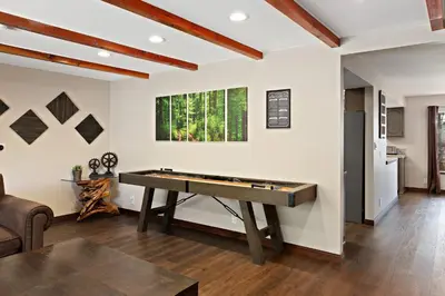 a living room with a pool table in it at Mountain Fun-1729 by Big Bear Vacations in Big Bear Lake