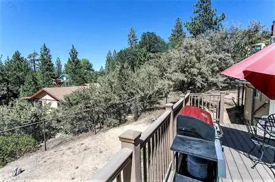 a car is parked on a fence on a balcony at Grandpas Axe-1775 by Big Bear Vacations in Big Bear Lake
