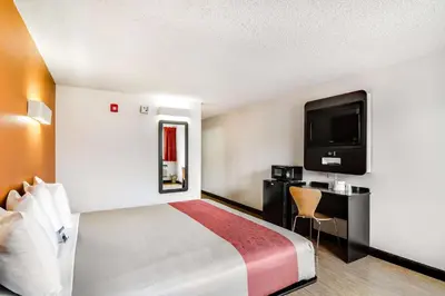 a hotel room with a bed and a flat screen tv at Motel 6-Carson, CA in Carson