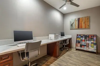 an office with a desk with a computer on it at Best Western Plus Hotel at the Convention Center in Long Beach