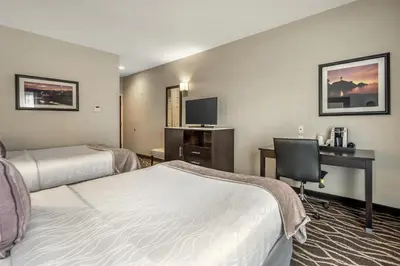 a hotel room with two beds and a desk at Best Western Plus Hotel at the Convention Center in Long Beach