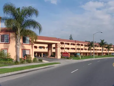 an empty street in front of a large building at Ramada by Wyndham Ontario Airport & Convention Center in Ontario