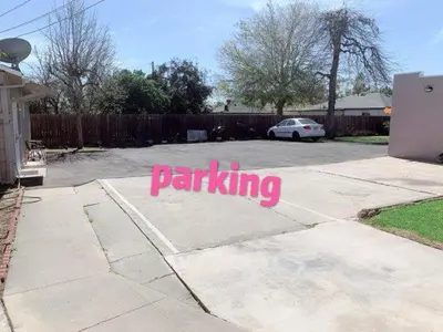 a parking lot with a pink sign on the ground at Pasadena suite with private entrance in Pasadena