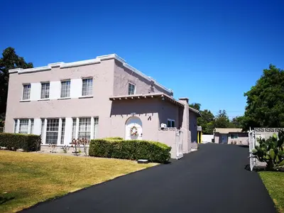 a large brick house with a driveway in front of it at Pasadena suite with private entrance in Pasadena