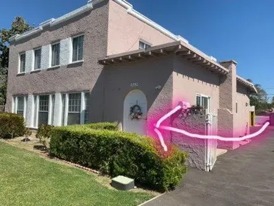 a house with pink paint on the side of it at Pasadena suite with private entrance in Pasadena