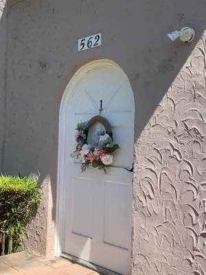 a white door with a wreath on it at Pasadena suite with private entrance in Pasadena