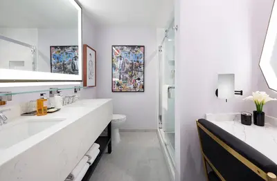 a white bathroom with a sink and a toilet at Montrose at Beverly Hills in Los Angeles
