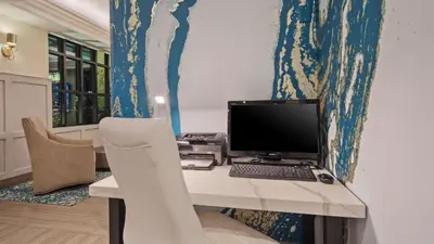 a desk with a computer on top of it at Best Western Woodland Hills in Woodland Hills