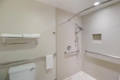 a bathroom with a shower and a toilet at Best Western Woodland Hills in Woodland Hills