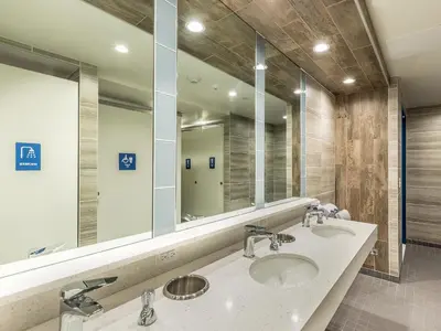 a bathroom with two sinks and a large mirror at HI Los Angeles Santa Monica Hostel in Los Angeles