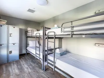 a room with three bunk beds in a dorm room at HI Los Angeles Santa Monica Hostel in Los Angeles