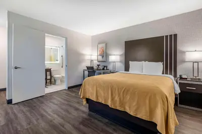 a hotel room with a bed and a bathroom at Quality Inn Burbank Airport in Burbank