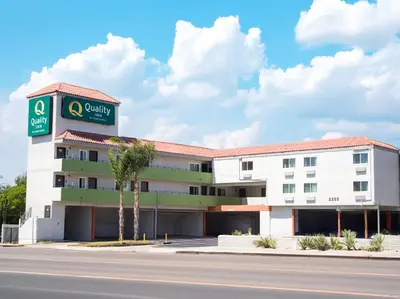 a building with a sign for a hotel at Quality Inn Burbank Airport in Burbank