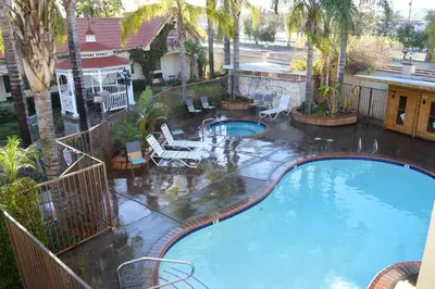 an overhead view of a large swimming pool at Dynasty Suites Redlands in Redlands