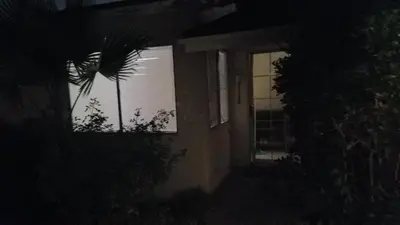 a house lit up at night with a window at Woodland Hills BEST Priced Room in Woodland Hills