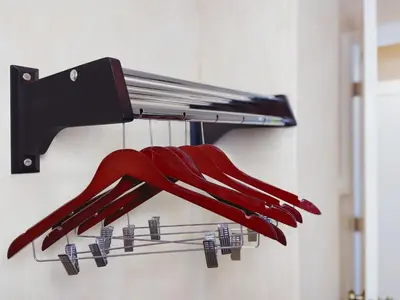 a bunch of red umbrellas hanging from a rack at Nite Inn at Universal City - Walking Distance to Universal Studios Hollywood in Los Angeles