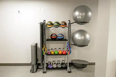 a fitness room with a rack with balls at Courtyard Culver City Los Angeles in Los Angeles
