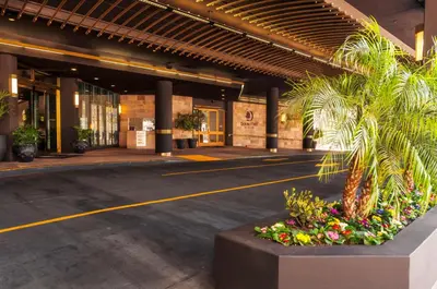 an empty parking lot in a building with a palm tree at Doubletree by Hilton Los Angeles Downtown in Los Angeles