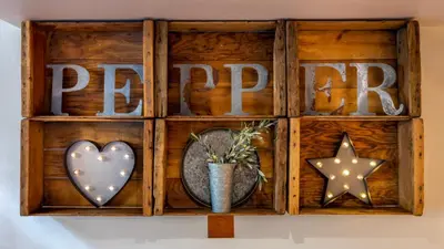 a wooden shelf with the word prepare and a heart and star at Hotel Pepper Tree Boutique Kitchen Studios - Anaheim in Anaheim