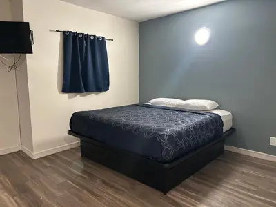 a bedroom with a bed in a room at Budget Inn Hollywood in Los Angeles