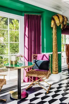 a green room with a table and a chair at The Prospect Hollywood in Los Angeles