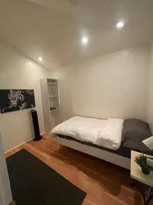a bedroom with a bed and a book shelf at Culver City Hostel in Los Angeles