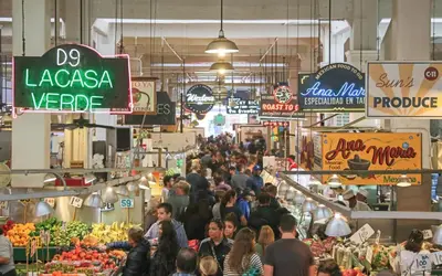 a crowd of people walking through a market at Angel City 1 bedroom Apartment in Los Angeles