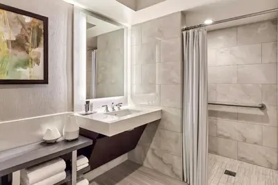 a bathroom with a sink and a shower at JW Marriott, Anaheim Resort in Anaheim