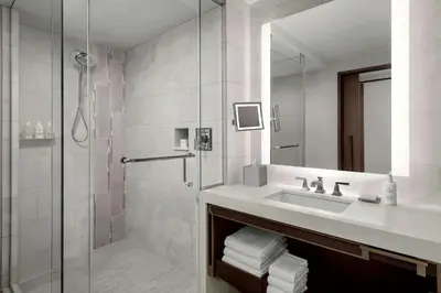 a bathroom with a sink and a shower at JW Marriott, Anaheim Resort in Anaheim