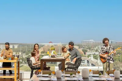 a group of people sitting at a table playing music at JW Marriott, Anaheim Resort in Anaheim