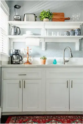 a kitchen with white cabinets and a sink at People's Choice Central Location Prkg & Patio LBD in Long Beach