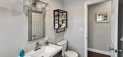 a bathroom with a sink and a toilet and a mirror at Top Pick Walk to Restaurants, Shops & Near Beach CC C in Los Angeles