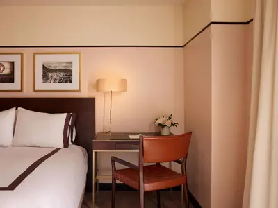 a hotel room with a bed and a desk at Sunset Tower Hotel in Los Angeles