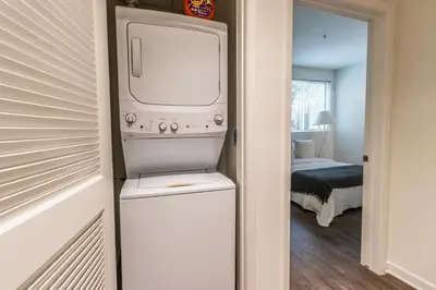 a white refrigerator with a tv in a room at 2BD 2BTH Condo 10 Min Walk to Santa Monica Beach in Los Angeles