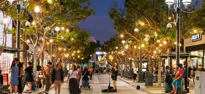 a crowd of people walking down a street at night at 2BD 2BTH Condo 10 Min Walk to Santa Monica Beach in Los Angeles