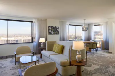 a living room with a couch and a table at The Westin Los Angeles Airport in Los Angeles