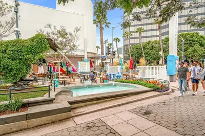 people walking around a pool at a resort at Renovateed Two-Bedroom Apartment in Santa Monica in Los Angeles