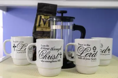 four coffee mugs with writing on them on a counter at Chic Apartment in Los Angeles