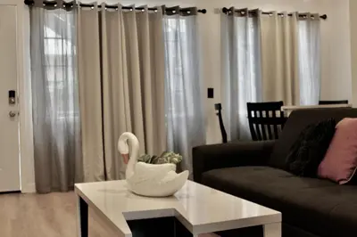 a living room with a white swan on a coffee table at Charming Apartment in Santa Monica