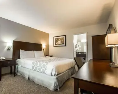 a hotel room with a bed and a desk at Rodeway Inn Convention Center in Los Angeles